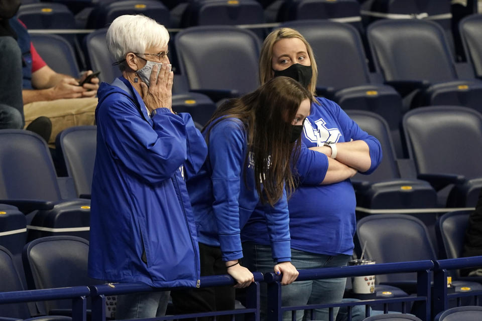 Kentucky fans watch the final moments of the second half of a loss to Mississippi State in an NCAA college basketball game in the Southeastern Conference Tournament Thursday, March 11, 2021, in Nashville, Tenn. (AP Photo/Mark Humphrey)
