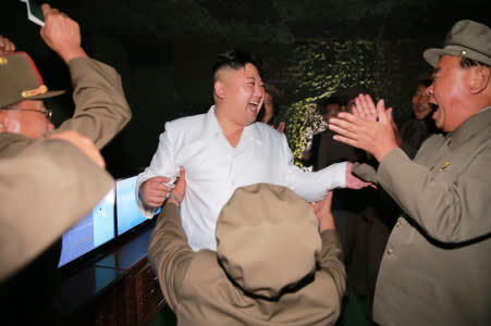 This undated picture released from North Korea's official Korean Central News Agency (KCNA) on August 25, 2016 shows North Korean leader Kim Jong-Un (C) laughing as he inspects a test-fire of strategic submarine-launched ballistic missile at an undisclosed location. / AFP / KCNA / KNS / South Korea OUT / REPUBLIC OF KOREA OUT / SOUTH KOREA OUT ---EDITORS NOTE--- RESTRICTED TO EDITORIAL USE - MANDATORY CREDIT "AFP PHOTO/KCNA VIA KNS" - NO MARKETING NO ADVERTISING CAMPAIGNS - DISTRIBUTED AS A SERVICE TO CLIENTS THIS PICTURE WAS MADE AVAILABLE BY A THIRD PARTY. AFP CAN NOT INDEPENDENTLY VERIFY THE AUTHENTICITY, LOCATION, DATE AND CONTENT OF THIS IMAGE. THIS PHOTO IS DISTRIBUTED EXACTLY AS RECEIVED BY AFP. / (Photo credit should read KNS/AFP/Getty Images)