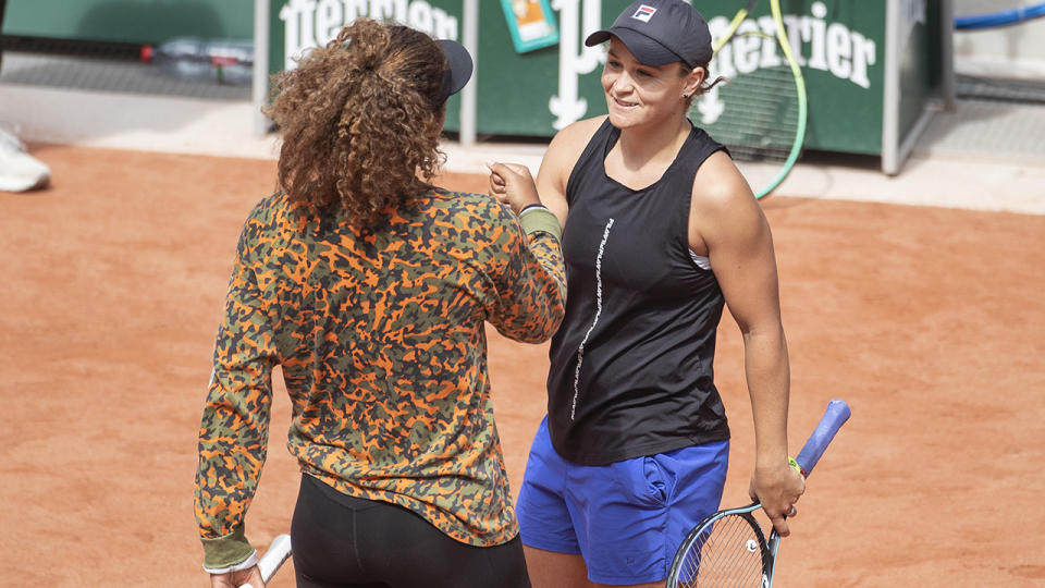 Naomi Osaka and Ash Barty, pictured here on the practice court at the French Open. 