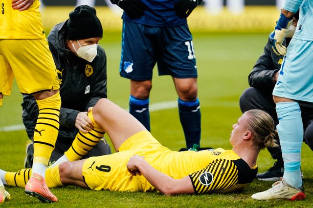 Borussia Dortmund’s Erling Haaland treated for an injury