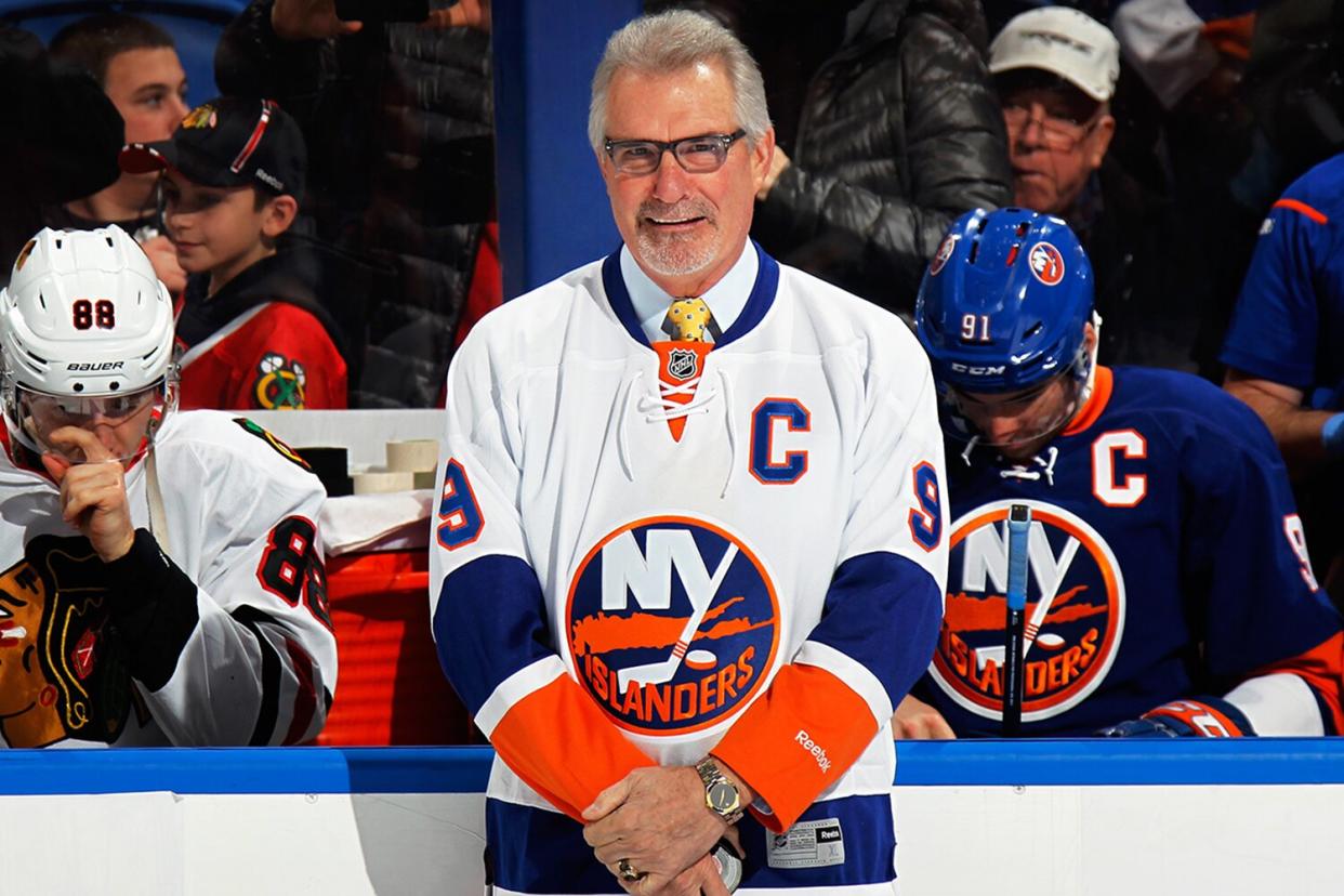 Former New York Islander Clark Gillies is honored prior to the game against the Chicago Blackhawks at the Nassau Veterans Memorial Coliseum on December 13, 2014 in Uniondale, New York.