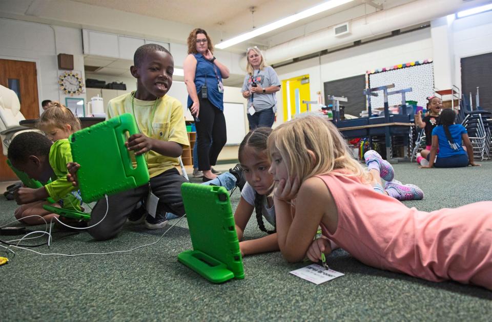 Myrtle Grove Elementary school kindergarten students finish the last day of the 2021-2022 school year by playing computer games May 24.