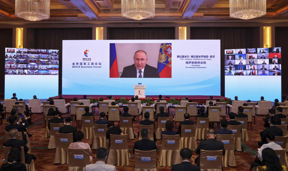 In this photo released by Xinhua News Agency, Russian President Vladimir Putin delivers a keynote speech in virtual format at the opening ceremony of the BRICS Business Forum in Beijing Wednesday, June 22, 2022. The conflict in Ukraine has "sounded an alarm for humanity," Chinese leader Xi Jinping said Wednesday, as China continues to assume a position of neutrality while backing its ally Russia. (Yin Gang/Xinhua via AP)