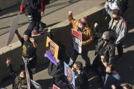 Demonstrators march through downtown Minneapolis following protests near the Hennepin County Government Center, Monday, March 8, 2021, in Minneapolis where the trial for former Minneapolis police officer Derek Chauvin began with jury selection. Chauvin is charged with murder in the death of George Floyd during an arrest last May in Minneapolis. (AP Photo/Jim Mone)