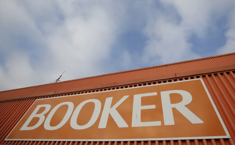 A branded sign is displayed outside of a Booker Wholesale store in London, Britain January 27, 2017. REUTERS/Neil Hall