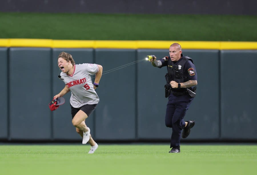 CINCINNATI, OHIO – JUNE 11: An unidentified fan is tased by a police officer as he runs on the field before the ninth inning of the Cincinnati Reds against Cleveland Guardians at Great American Ball Park on June 11, 2024 in Cincinnati, Ohio. (Photo by Andy Lyons/Getty Images)