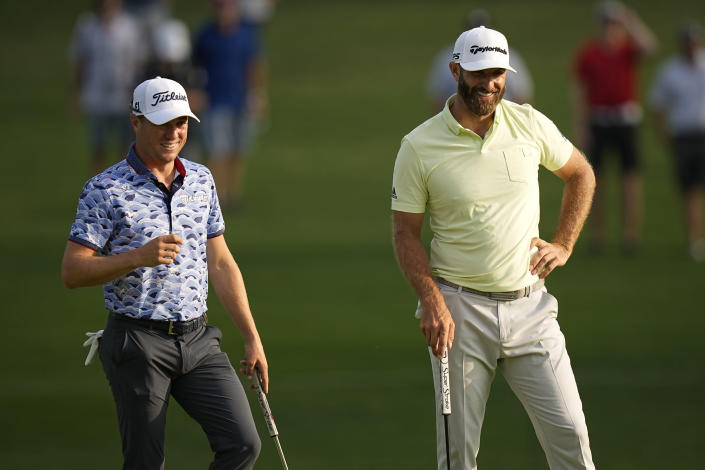 Justin Thomas and Dustin Johnson smile on the 10th hole during the second round of the PGA Championship golf tournament at Southern Hills Country Club, Friday, May 20, 2022, in Tulsa, Okla. (AP Photo/Eric Gay)
