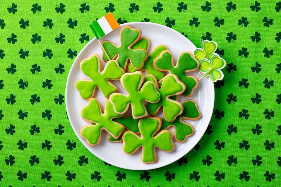 st patricks day activities plate of shamrock cookies with green icing