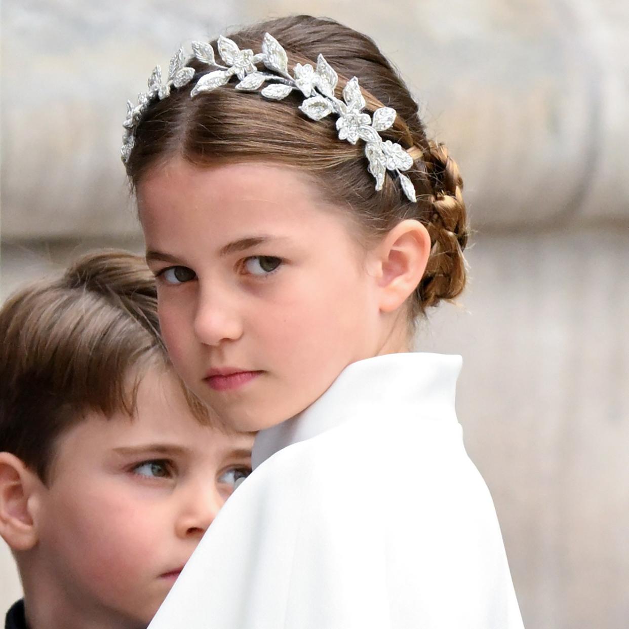  Princess Charlotte in a headpiece at King Charles' Coronation. 