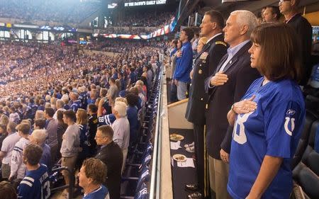 Vice President Mike Pence and Second Lady Karen Pence stand during the national anthem prior to the start of an NFL football game between the Indiana Colts and the San Francisco 49ers at the Lucas Oil Stadium in Indianapolis, Indiana, U.S., October 8, 2017. White House/Myles Cullen/Handout via REUTERS