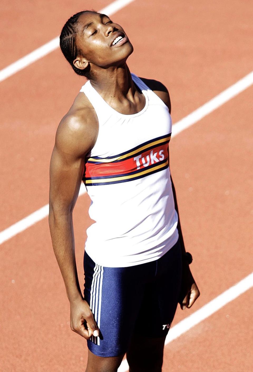 a woman running on a track