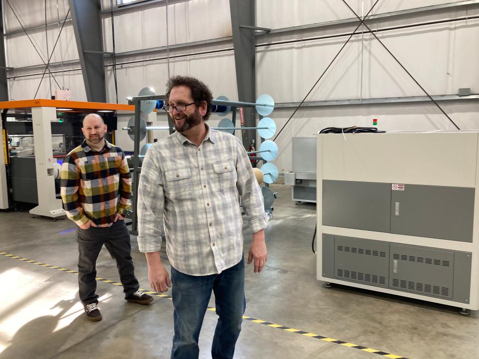 Scot Hull, director of manufacturing for JEMS by Pensole in Somersworth, leads a tour of the shoe factory on Monday, March 20, 2023.