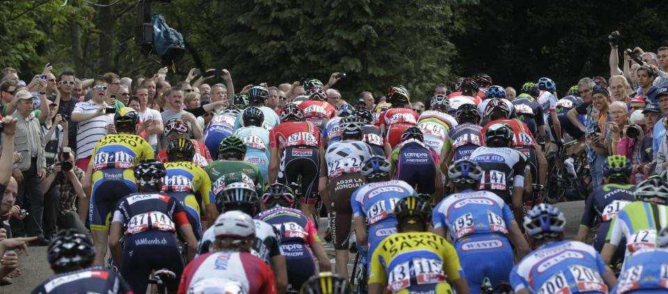 Fans watch as cyclists climb the 'wall of Huy' during the Belgian cycling classic and UCI World Tour race Walloon Arrow/Fleche Wallonne, in Huy, Belgium, Wednesday, April 23, 2014. (AP Photo/Yves Logghe)