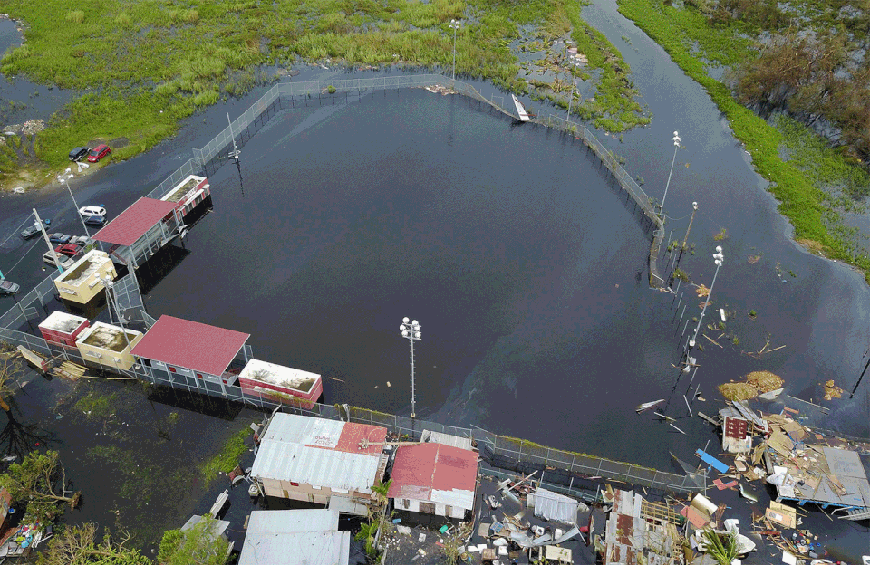 An aerial view of the flooded neighborhood of Juana Matos on Sept. 22, 2017, and then on March 17, 2018.