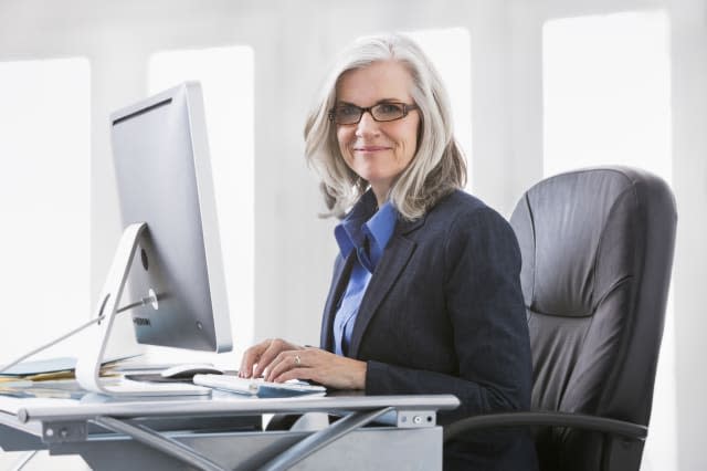 Portrait of confident Caucasian working at computer