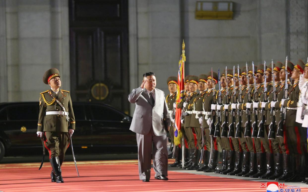 North Korean leader Kim Jong Un salutes as he attends a parade to mark the 75th anniversary of the founding of the ruling Workers' Party of Korea - REUTERS
