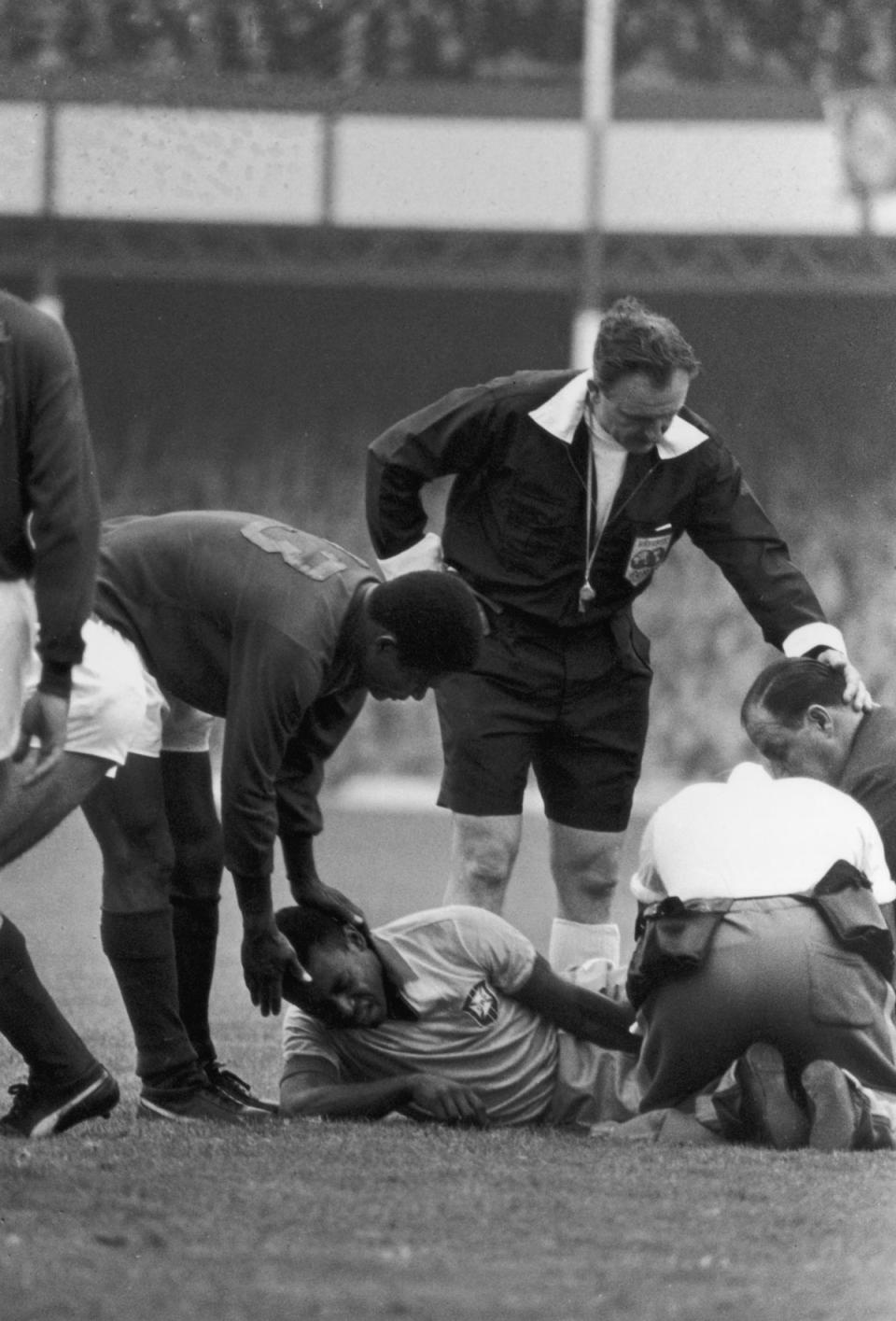 19th July 1966: Pele writhes in agony, having been injured in a tackle during the World Cup match against Portugal at Goodison Park, Liverpool. (Getty Images)