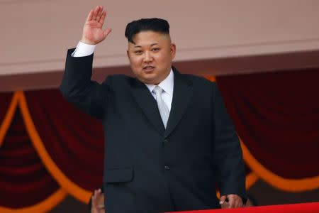 North Korean leader Kim Jong Un waves to people attending a military parade marking the 105th birth anniversary of country's founding father, Kim Il Sung in Pyongyang, April 15, 2017. REUTERS/Damir Sagolj/Files