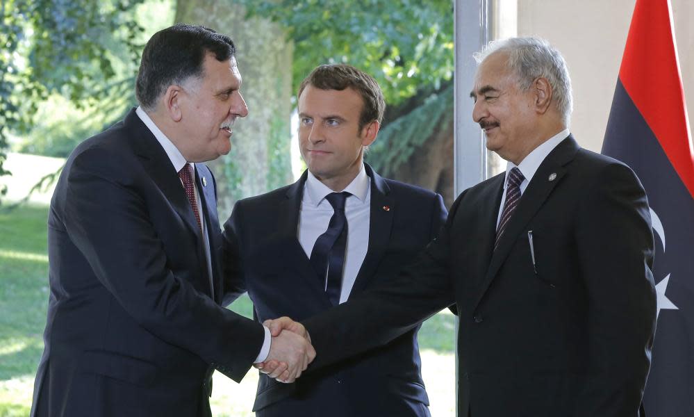 Macron (centre) with Fayez al-Sarraj and Gen Khalifa Haftar last summer.