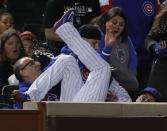 Jun 5, 2018; Chicago, IL, USA; Chicago Cubs second baseman Javier Baez (9) crashes into the seats after making a catch for an out on a ball hit by Philadelphia Phillies center fielder Odubel Herrera (37) during the ninth inning at Wrigley Field. Mandatory Credit: Jim Young-USA TODAY Sports