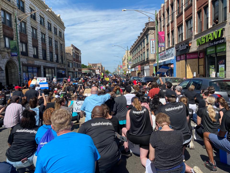 Hundreds of people take a knee at a "Peace Walk" in Chicago's South Side Chatham neighborhood on June 7, 2020.