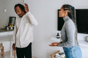 Black woman trying to talk her partner who's shutting her out