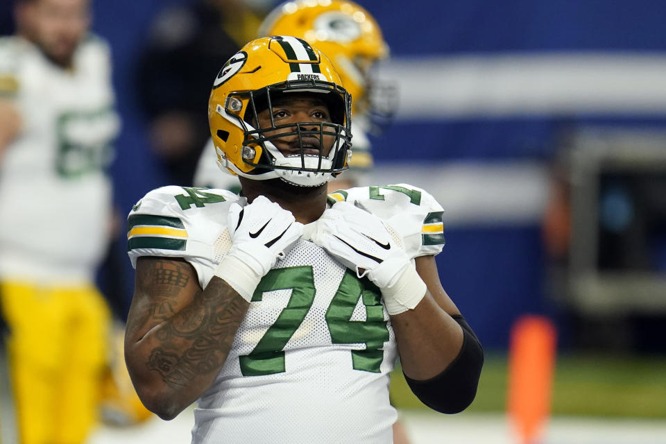 FILE - In this Nov. 22, 2020, file photo, Green Bay Packers offensive guard Elgton Jenkins (74) warms up before an NFL football game between the Indianapolis Colts in Indianapolis. Jenkins has spent his NFL career demonstrating he can thrive at just about every spot on the offensive line at one time or another. Now the Pro Bowl left guard looks forward to his biggest test yet as he fills in for injured All-Pro selection David Bakhtiari at left tackle and leads a Packers line that likely will include two rookie starters. (AP Photo/Michael Conroy, File)