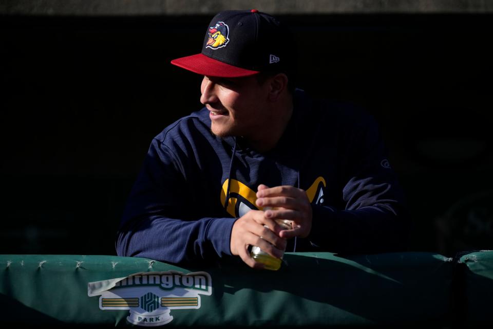 Apr 18, 2023; Columbus, Ohio, United States;  Dublin Scioto and Ohio State University graduate, and pitcher for the Toledo Mud Hens, Andrew Magno talks with teammates in the visitor’s dugout at Huntington Park prior to the Mud Hens’ game against the Columbus Clippers. Mandatory Credit: Joseph Scheller-The Columbus Dispatch