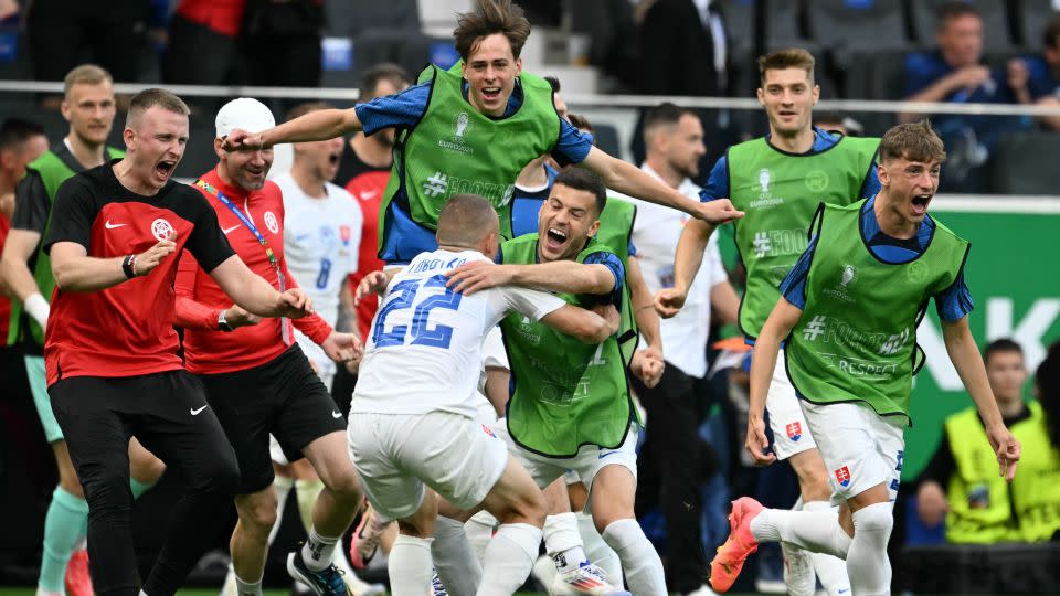 Slovakia's players celebrate beating Belgium in their opening Euro 2024 game. - Thomas Kienzle/AFP/Getty Images