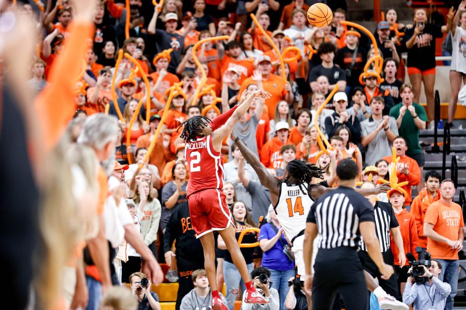 Oklahoma guard Javian McCollum (2) shoots the game-winning 3-pointer in overtime during an NCAA basketball game between Oklahoma and Oklahoma State in Stillwater, Okla., on Saturday, Feb. 24, 2024.
