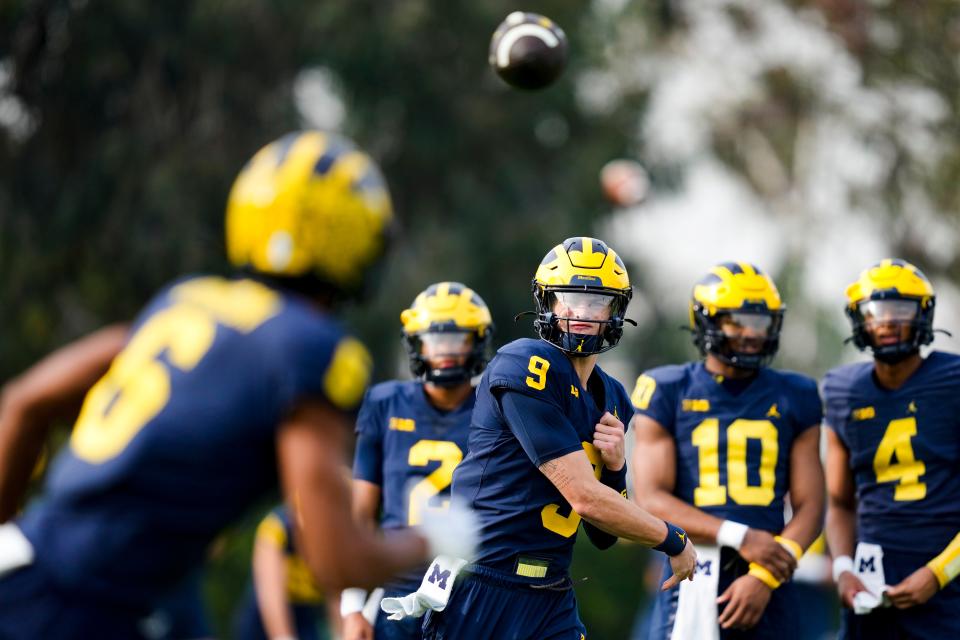 Michigan quarterback J.J. McCarthy (9) throws to wide receiver Cornelius Johnson (6) during practice Friday, Dec. 29, 2023, in Carson, Calif. Michigan is scheduled to play against Alabama on New Year's Day in the Rose Bowl, a semifinal in the College Football Playoff.