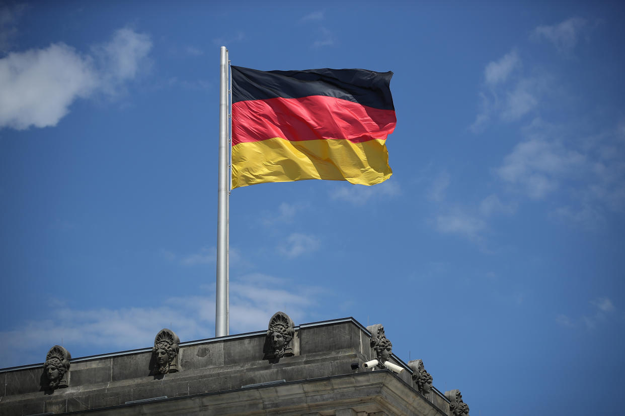 BERLIN, GERMANY - JULY 02:  A German flag flies over a corner of the Reichstag on July 2, 2018 in Berlin, Germany. The future of the present German government is uncertain as German Chancellor and leader of the Chistian Democrats (CDU) Angela Merkel and German Interior Minister and leader of the Bavarian sister party of the CDU, the CSU, Horst Sehhofer, remain locked in an uncompromising deadlock over migration policy.  (Photo by Sean Gallup/Getty Images)