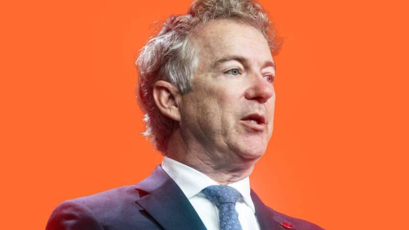 Senator Rand Paul in front of orange background