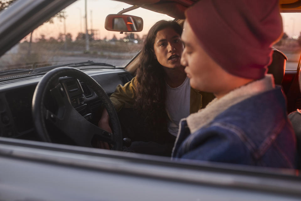 A couple arguing in a car