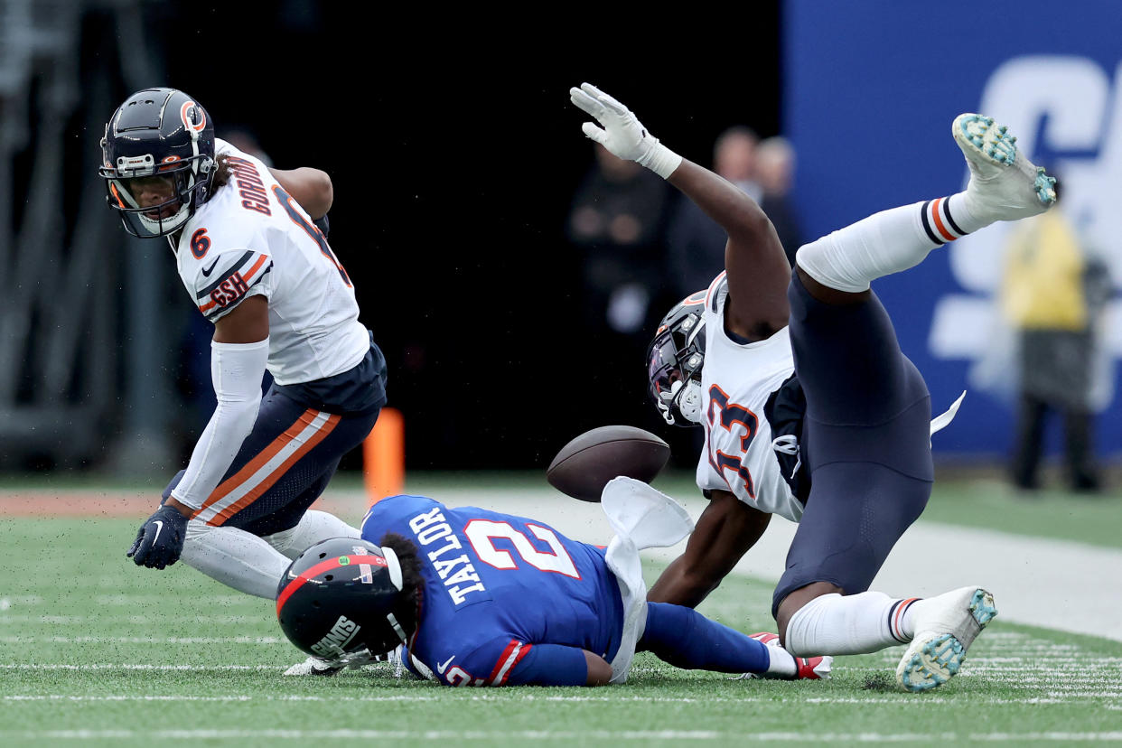 Oct 2, 2022; East Rutherford, New Jersey, USA; New York Giants quarterback Tyrod Taylor (2) fumbles the ball after being hit by Chicago Bears cornerback Kyler Gordon (6) and linebacker Nicholas Morrow (53) during the fourth quarter at MetLife Stadium. Mandatory Credit: Brad Penner-USA TODAY Sports