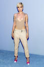 <p>The singer looked ready to hit the beach when she arrived at Tom Ford in a plunging bodysuit and low-cut khaki pants. (Photo: Getty Images) </p>