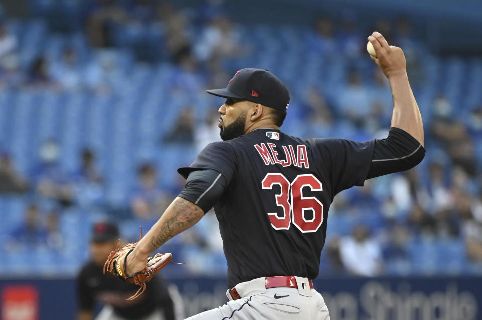 Cleveland Indians' J. C. Mejia pitches against the Toronto Blue Jays during the first inning of a baseball game Wednesday, Aug. 4, 2021, in Toronto. (Jon Blacker/The Canadian Press via AP)