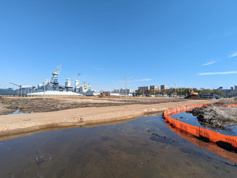 The Battleship North Carolina is turning part of its parking lot into natural wetlands to help deal with tidal flooding. The rest of the parking lot will be raised and thousands of native plants and trees added to help absorb contaminants before they reach the adjacent Cape Fear River.