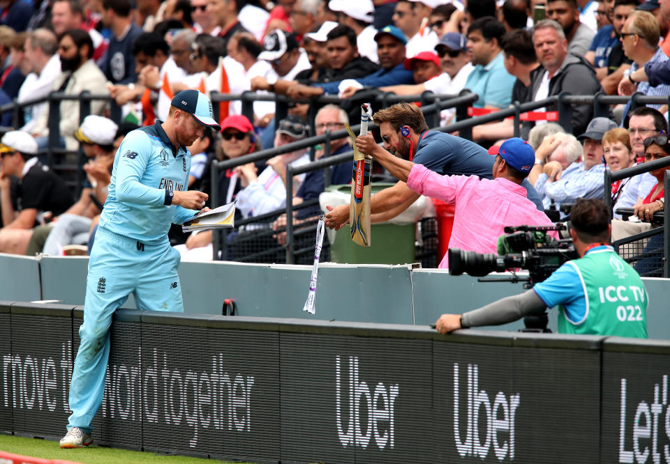 England's Jonny Bairstow signs autographs during the ICC World Cup Final at Lord's, London.