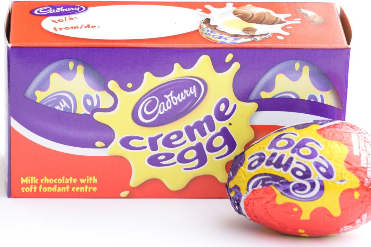 Kitchener, Ontario, Canada - March 20, 2011: A box of Cadbury Creme Eggs with one sitting out front.  This Easter chocolate is available each year but only for a limited time.