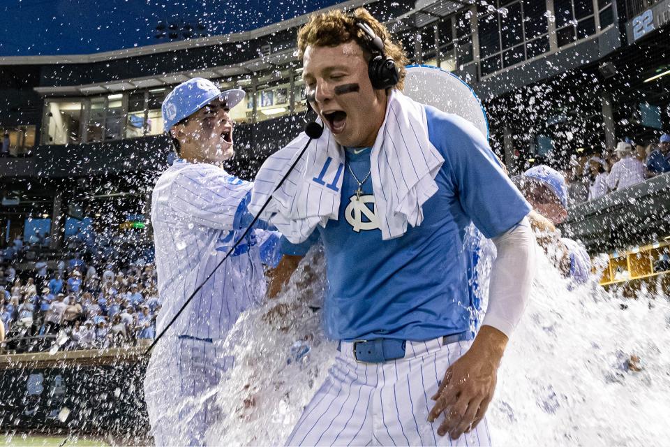 UNC's Vance Honeycutt is doused after a win in the super regional.