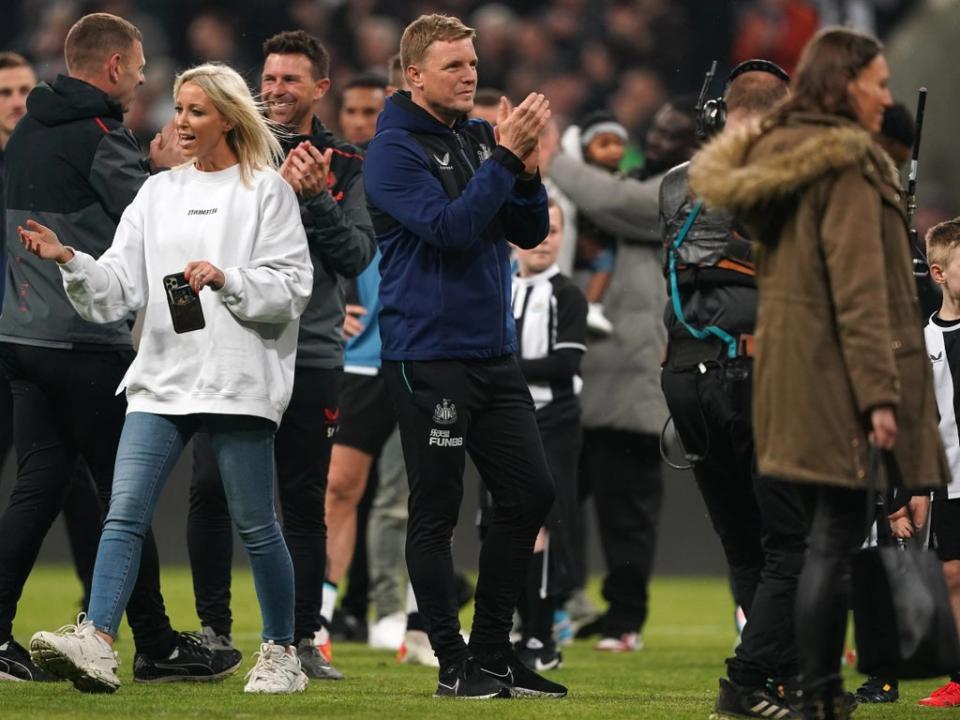 Eddie Howe was on the pitch with his Newcastle players, staff and their families after the win over Arsenal  (PA Wire)