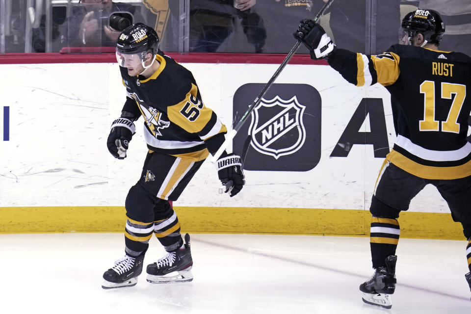 Pittsburgh Penguins' Jake Guentzel (59) skates back to the bench after scoring against the Montreal Canadiens during the first period of an NHL hockey game in Pittsburgh, Tuesday, March 14, 2023. (AP Photo/Gene J. Puskar)