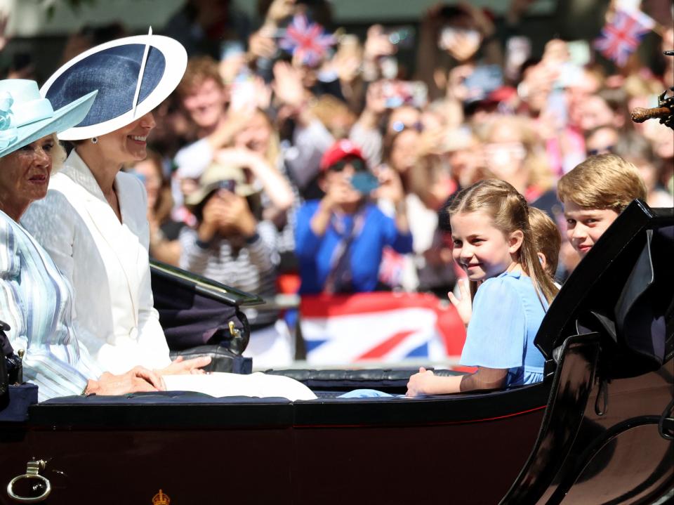 Princess Charlotte, Prince George and Prince Louis ride in a carriage during the Trooping the Colour parade (REUTERS)