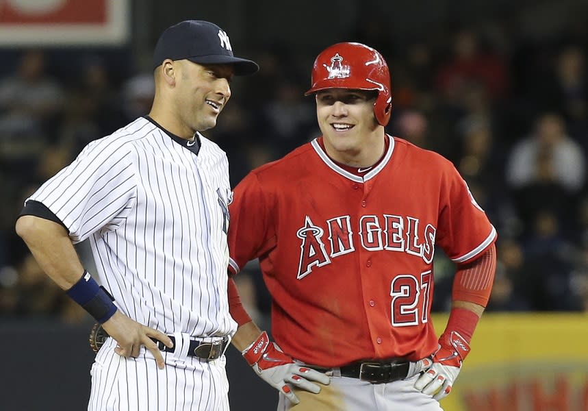 Mike Trout (right) and Derek Jeter shared an awkward first meeting thanks to Trout’s oddly-timed autograph request. (AP)