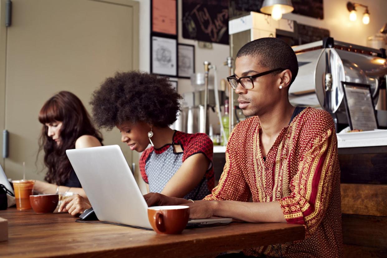 Coffee shops can be a "third space" – not home or the office – where remote or gig workers can go to feel less isolated. <a href="https://www.gettyimages.com/detail/photo/people-using-technology-in-coffee-shop-royalty-free-image/514408997?adppopup=true" rel="nofollow noopener" target="_blank" data-ylk="slk:Granger Wootz/Tetra images via Getty Images;elm:context_link;itc:0;sec:content-canvas" class="link ">Granger Wootz/Tetra images via Getty Images</a>