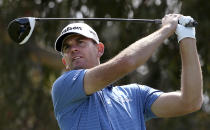 Brendan Steele of the U.S.A. tees off on the second during the Australian Open Golf tournament in Sydney, Thursday, Nov. 15, 2018. (AP Photo/Rick Rycroft)