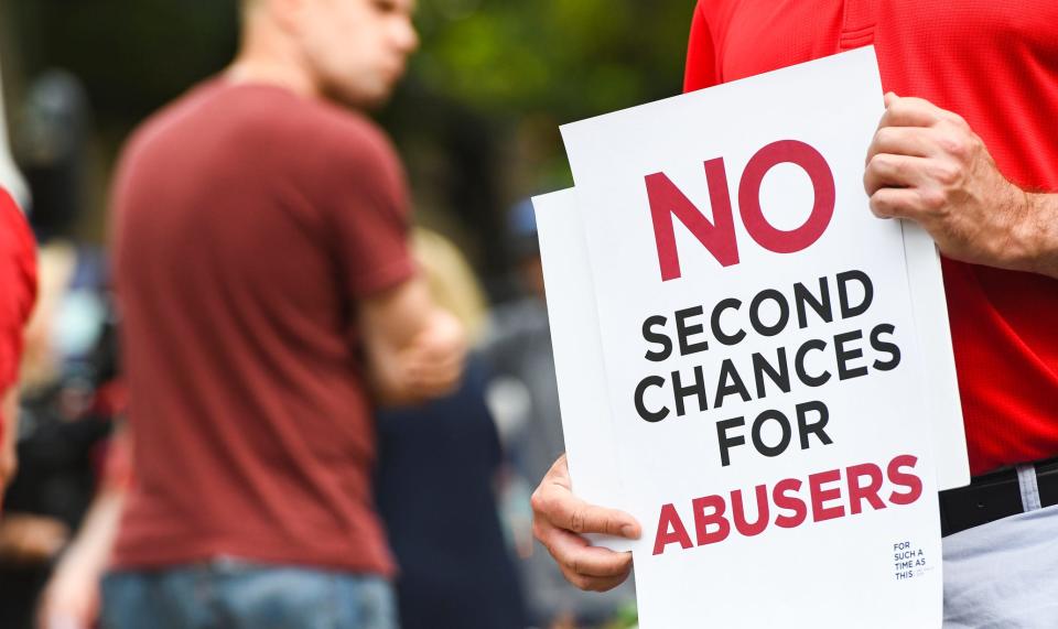 Protesters rally outside the Southern Baptist Convention's annual meeting Tuesday, June 11, 2019, during a rally in Birmingham, Ala. (AP Photo/Julie Bennett)