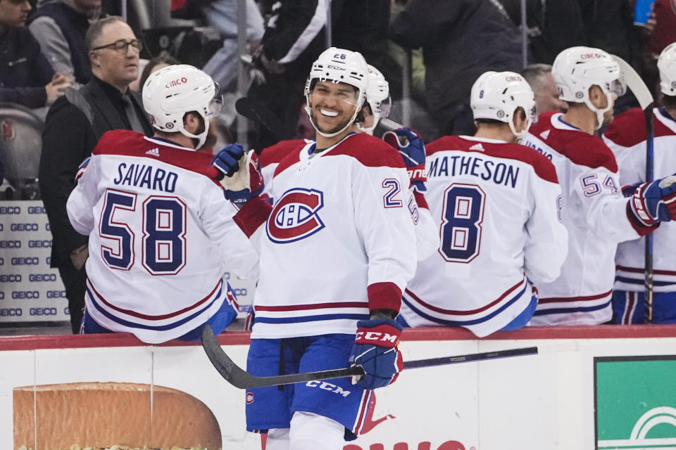 Montreal Canadiens' Johnathan Kovacevic celebrates with teammates after scoring a goal during the second period of an NHL hockey game against the New Jersey Devils Tuesday, Feb. 21, 2023, in Newark, N.J. (AP Photo/Frank Franklin II)