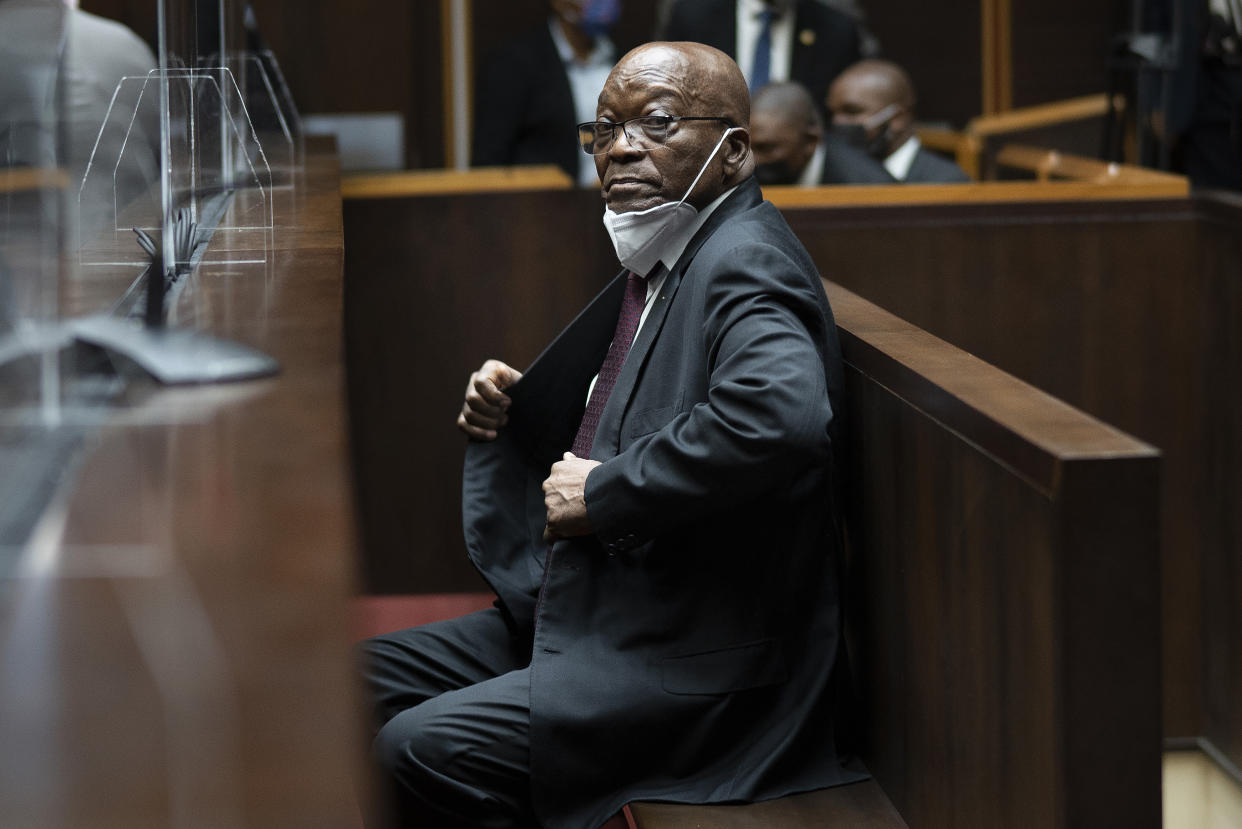 FILE — Former South African President Jacob Zuma, sits in the High Court in Pietermaritzburg, South Africa, Oct. 26, 2021. A South African court on Wednesday, Dec. 15 has ordered Zuma should go back to prison after withdrawing the medical parole given to him earlier this year. (AP Photo/Jerome Delay, File)